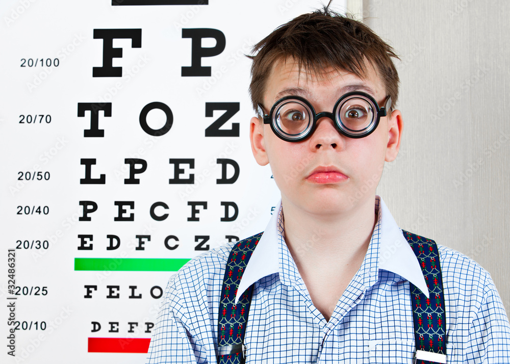person wearing spectacles in an office at the doctor person wearing spectacles in an office at the doctor