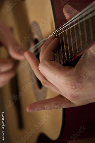 The musician plays a guitar