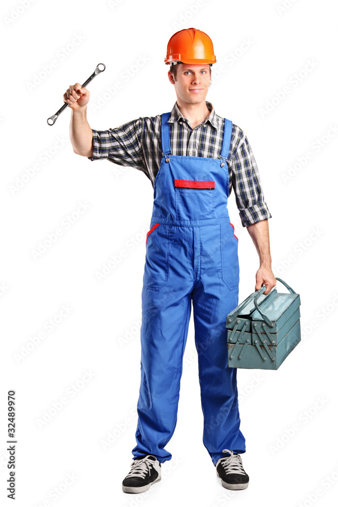 Repairman in overall holding a toolbox and wrench Repairman in overall holding a toolbox and wrench
