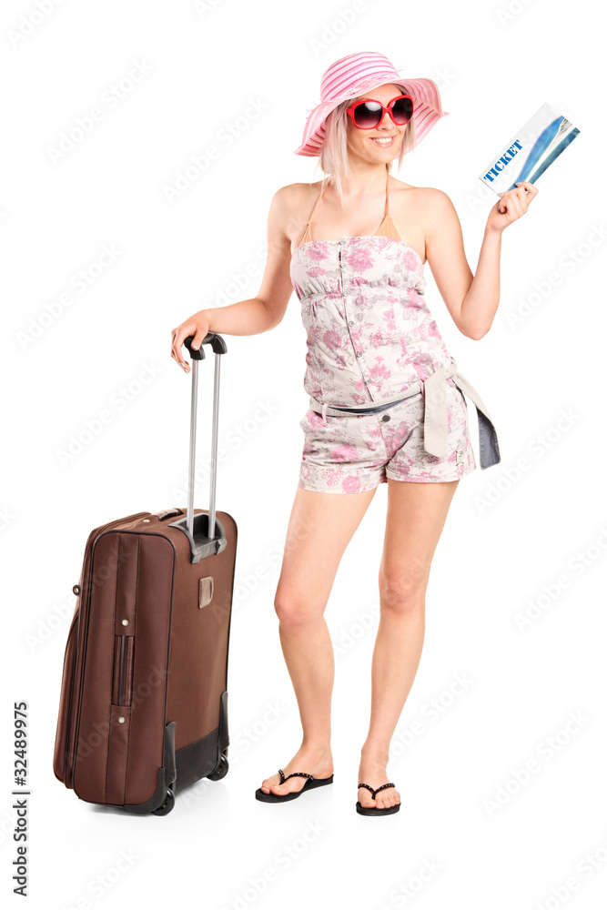 Tourist girl holding a ticket and luggage Tourist girl holding a ticket and luggage