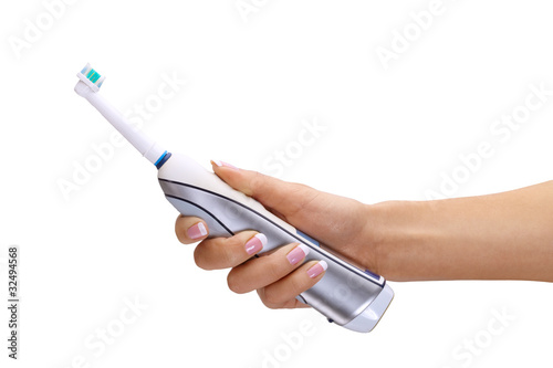 Obraz na plátně Hand holding electric toothbrush