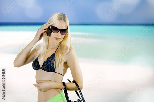 Young sexy woman in summer about open water photo