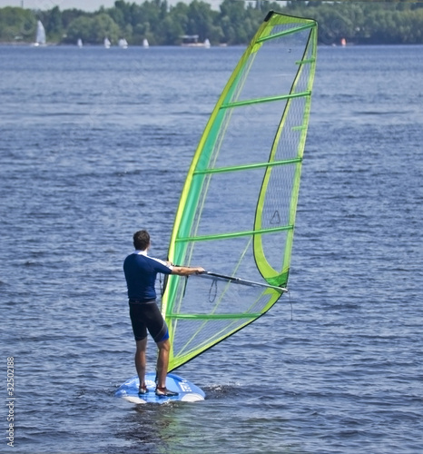 A man windsurfing on the private pond