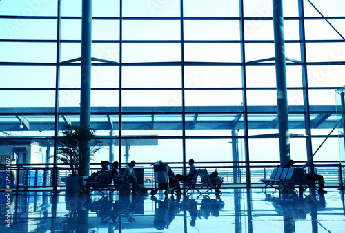 travelers silhouettes at airport