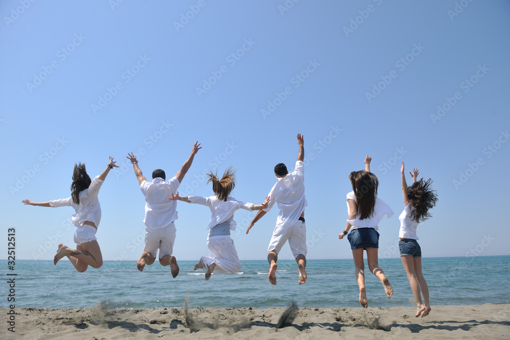 happy people group have fun and running on beach happy people group have fun and running on beach