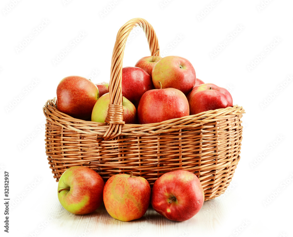 Apples and wicker basket isolated on white Apples and wicker basket isolated on white