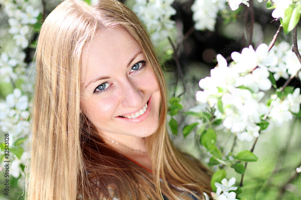 Portrait of beautiful blond in spring blossom Portrait of beautiful blond in spring blossom