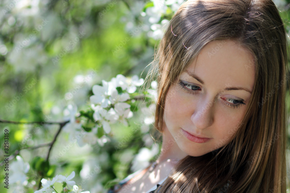 Portrait of beautiful blond in spring blossom Portrait of beautiful blond in spring blossom