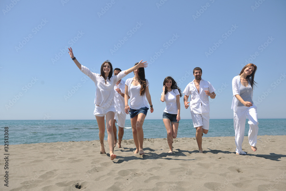 happy people group have fun and running on beach happy people group have fun and running on beach