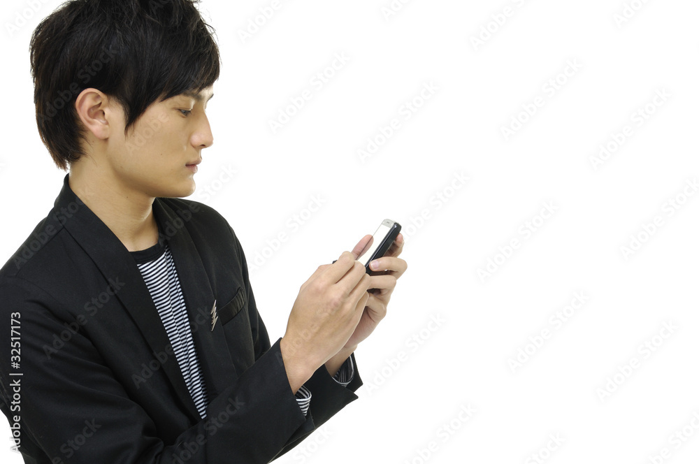Young happy man holding mobile phone Young happy man holding mobile phone