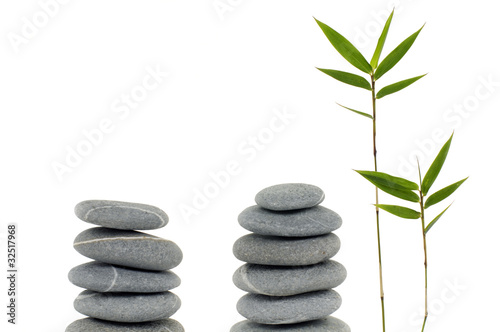 balanced stones with bamboo leaf