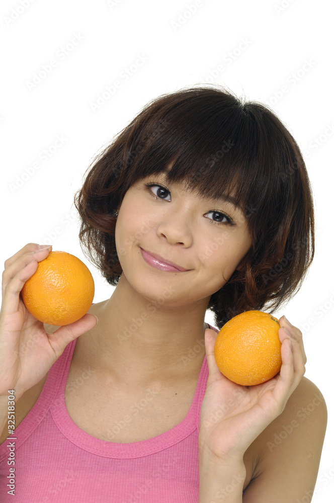 Portrait of young smiling woman showing tropical fruit Portrait of young smiling woman showing tropical fruit