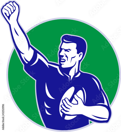 rugby player with ball pumping fist
