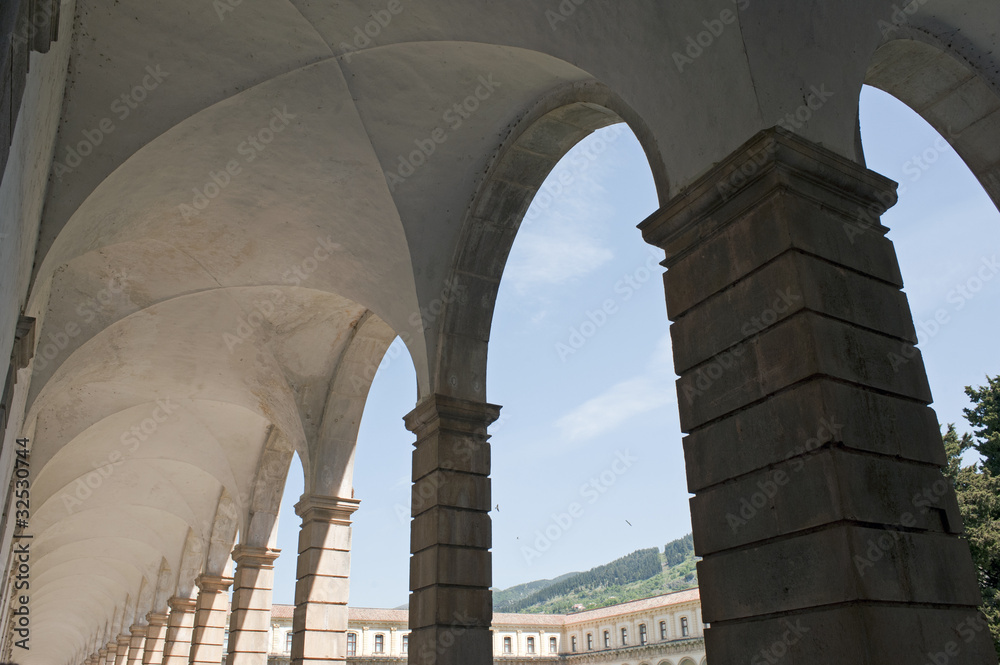 An old cloister with arched portico