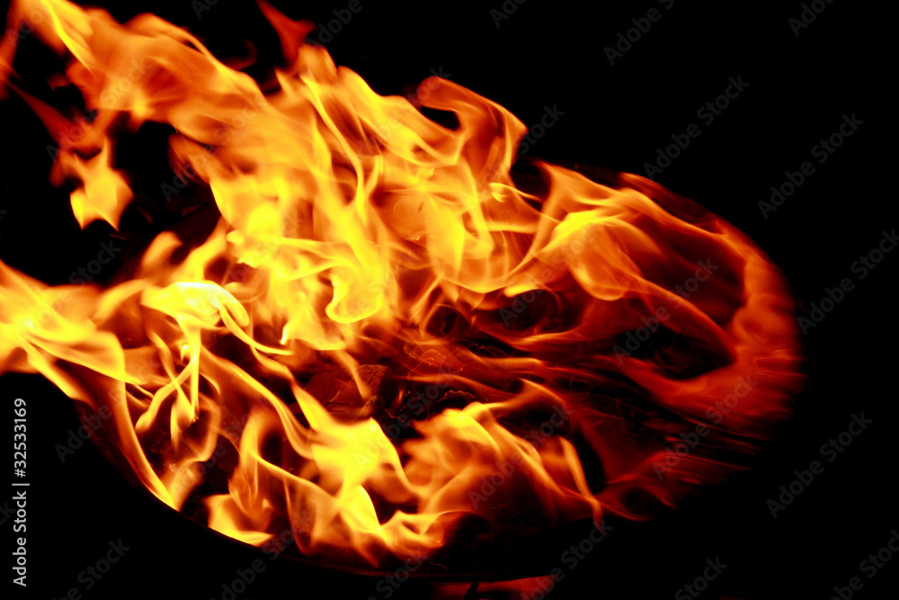 Fototapeta premium Bright red yellow fire on black background