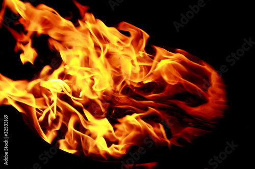 Bright red yellow fire on black background
