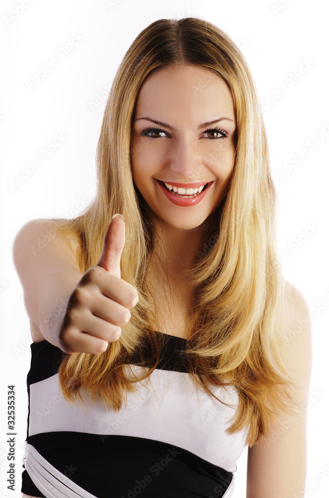 Beautiful blond girl showing thumbs up and smiling, isolated Beautiful blond girl showing thumbs up and smiling, isolated