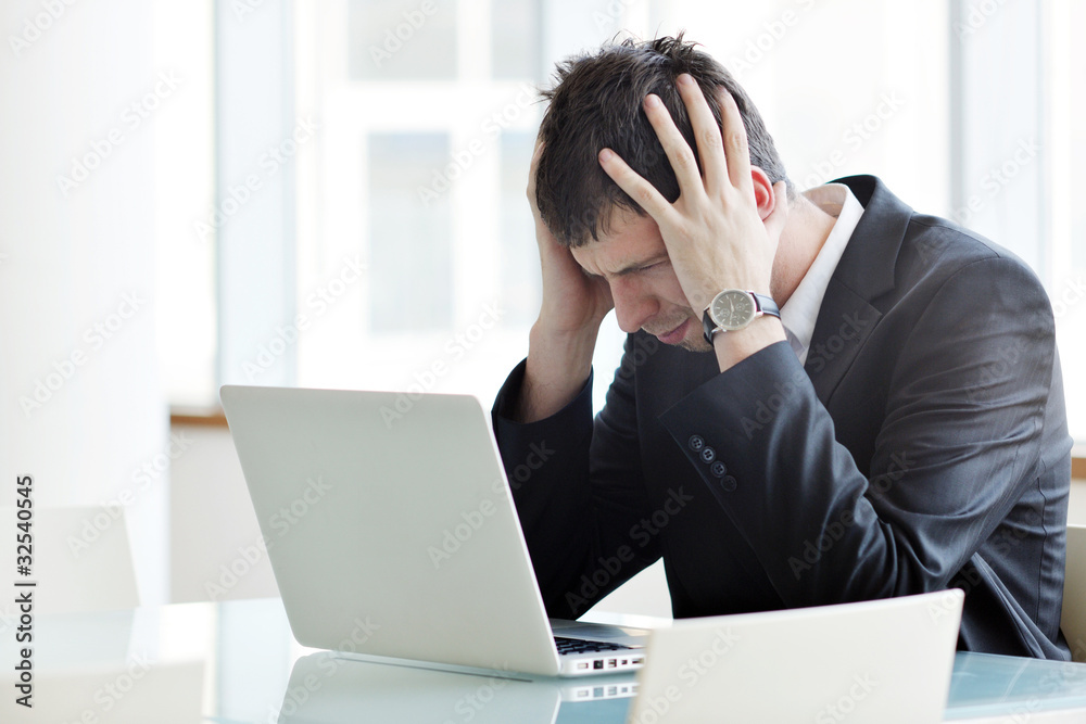 young business man alone in conference room young business man alone in conference room