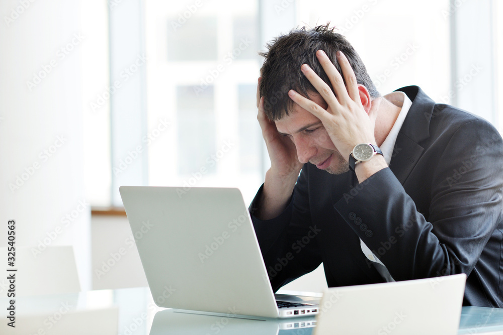 young business man alone in conference room young business man alone in conference room