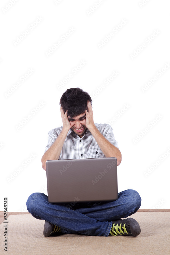 Young working with his laptop Young working with his laptop