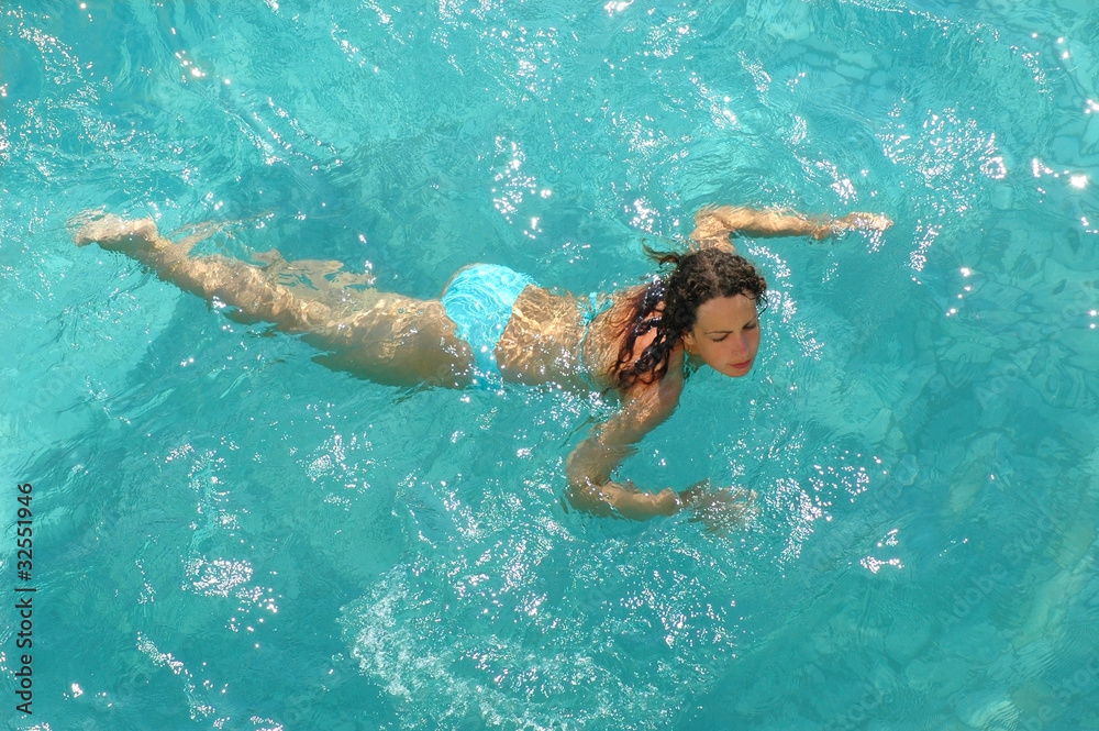 Woman swimming in water pool