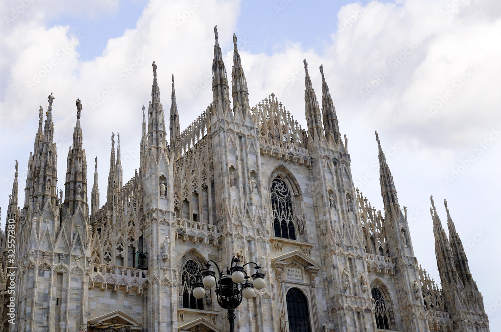 The Gothic facade of the Cathdral in Milan Italy