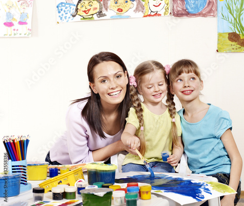 Child painting in preschool.