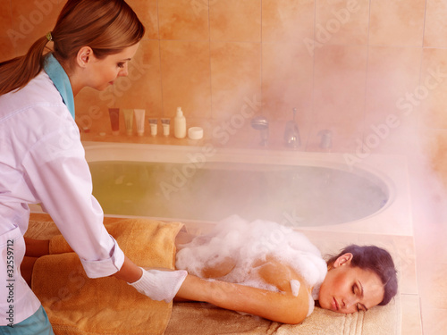 Woman in hammam or turkish bath photo