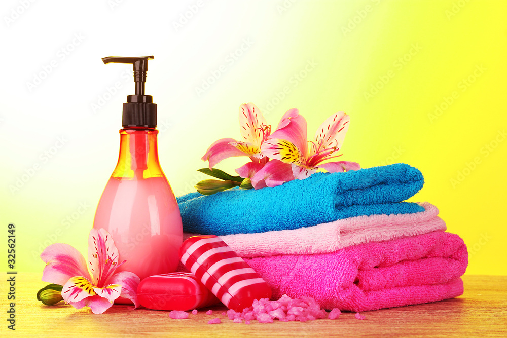 Cosmetic cream and lily on yellow background Cosmetic cream and lily on yellow background