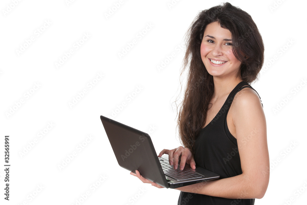 Young female working on laptop isolated on white Young female working on laptop isolated on white