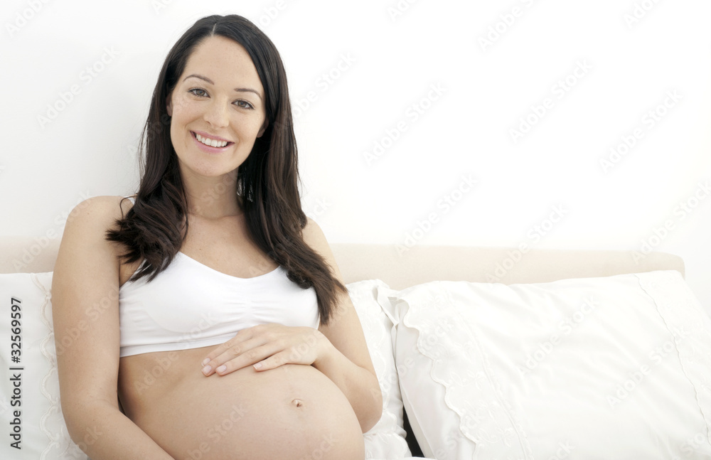 Happy pregnant woman in bed Happy pregnant woman in bed
