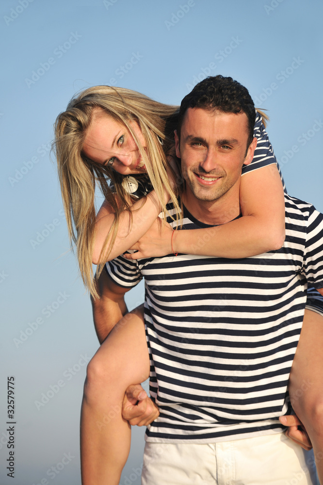 happy young couple have romantic time on beach