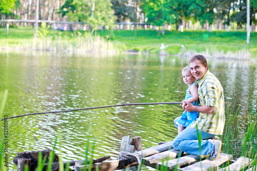 Father and the son on a river