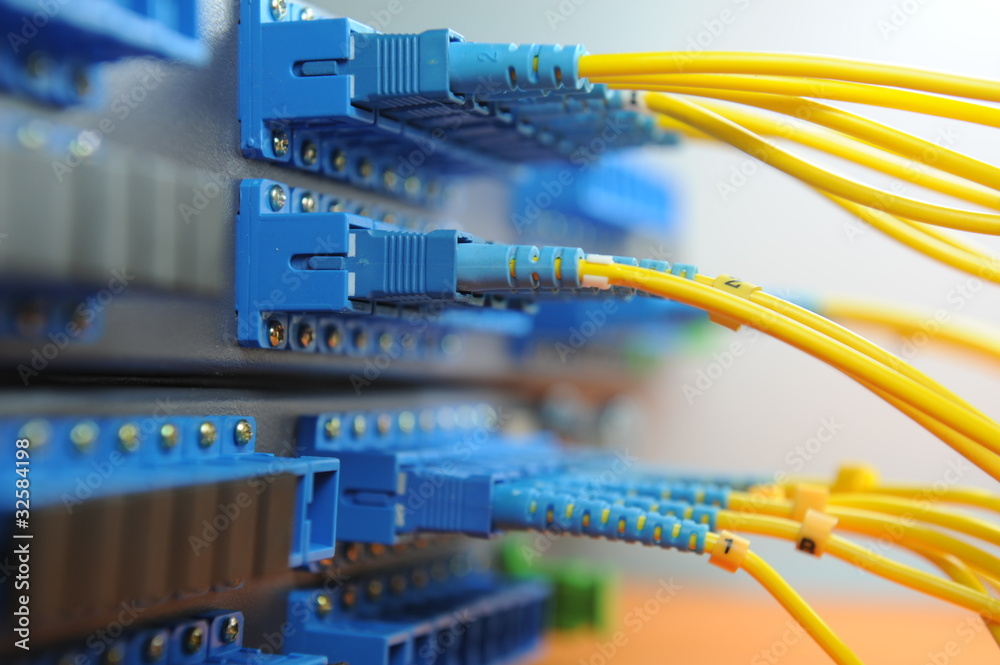 shot of network cables and servers in a technology data center shot of network cables and servers in a technology data center