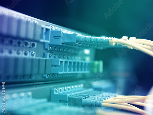 Obraz na płótnie network cables and servers in a technology data center