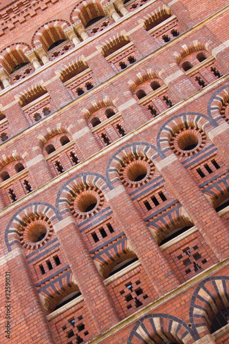 Towering brickwork of a nineteenth century granary in Bristol UK