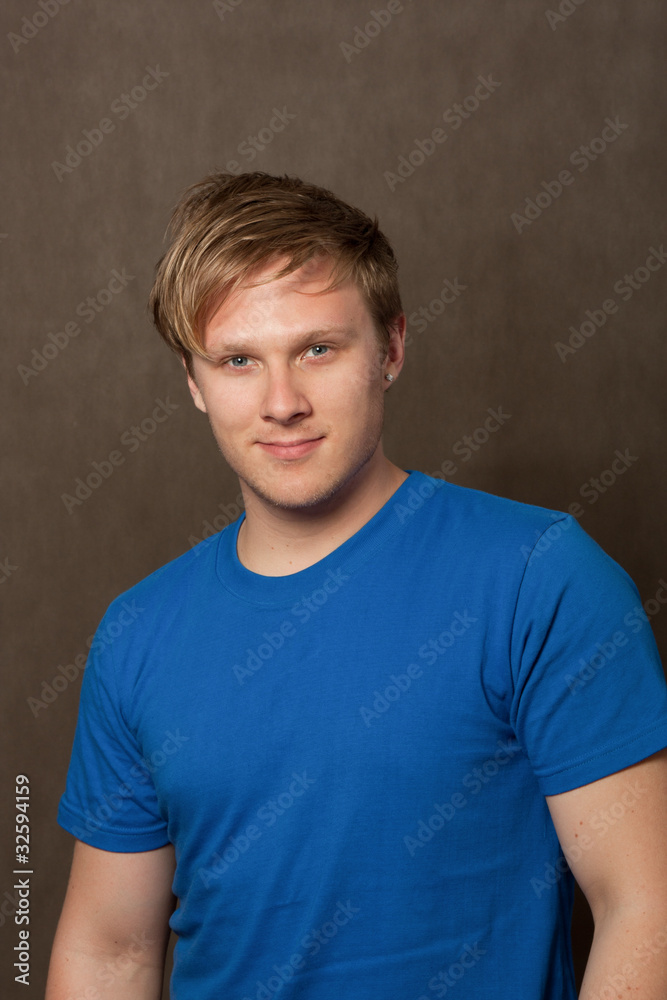 portrait of a young man in a blue t-shirt portrait of a young man in a blue t-shirt