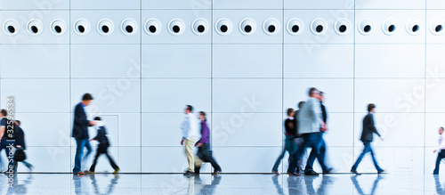 Trade fair walkway with blurred people photo