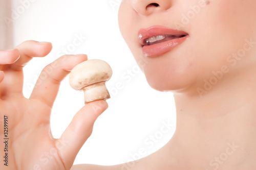 Female model with a champignon mushroom