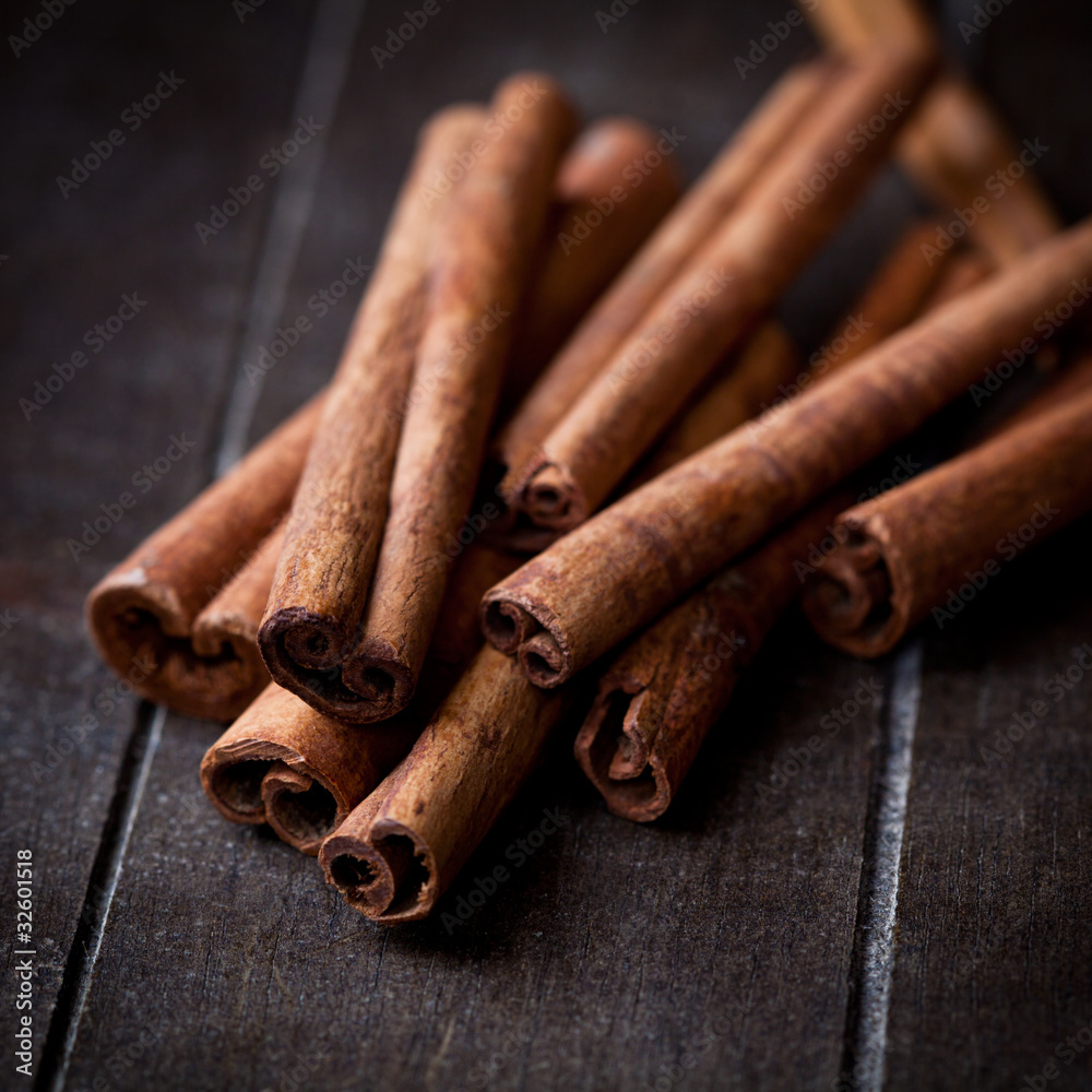 Cinnamon sticks on rustic wooden background Cinnamon sticks on rustic wooden background