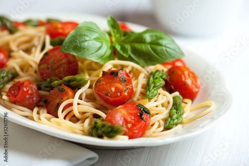 Spaghetti with green asparagus and cherry tomato