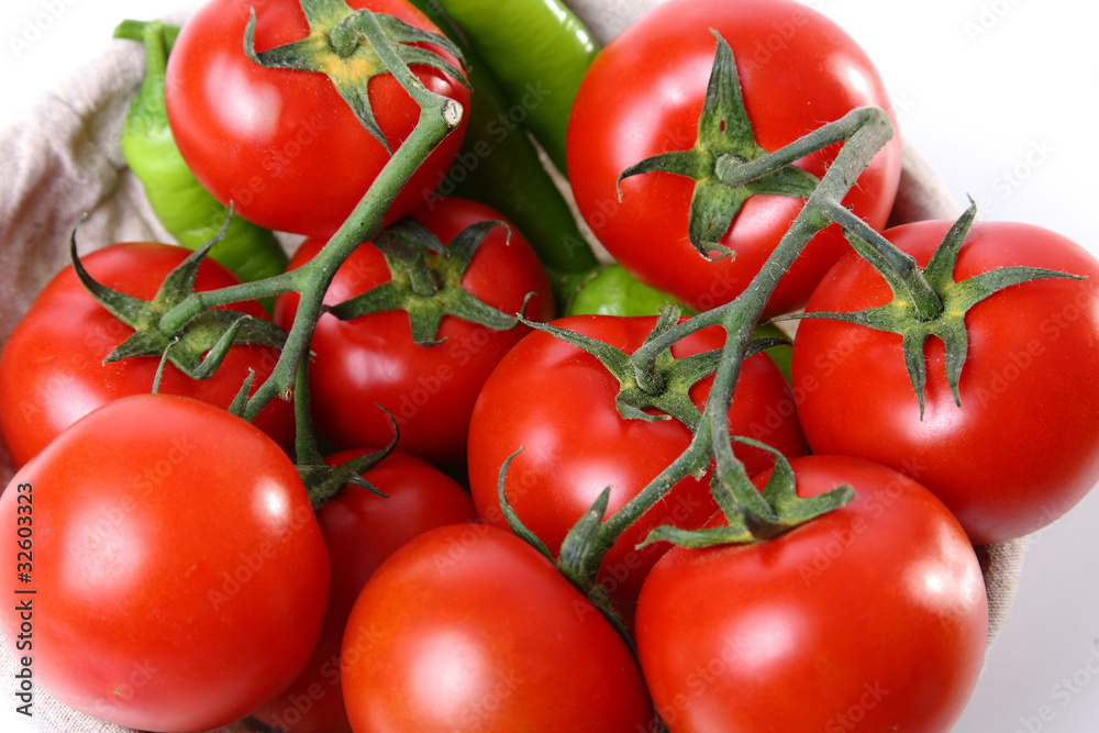 Close-up of red tomatoes and green peperoni Close-up of red tomatoes and green peperoni