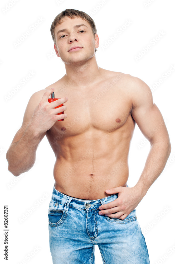 Cosmetic wellness man spraying fragrance Cosmetic wellness man spraying fragrance
