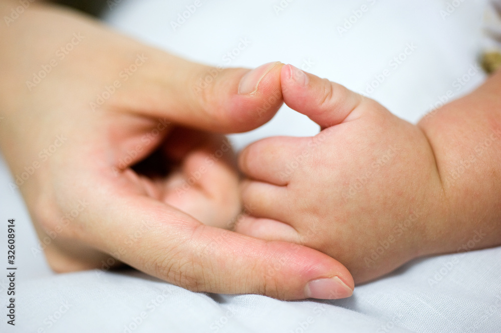Mother's and baby's hands Mother's and baby's hands