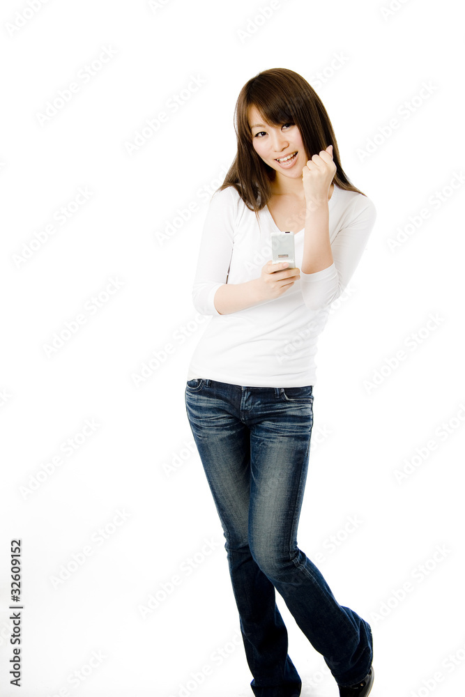 電話とガッツポーズの女性 電話とガッツポーズの女性
