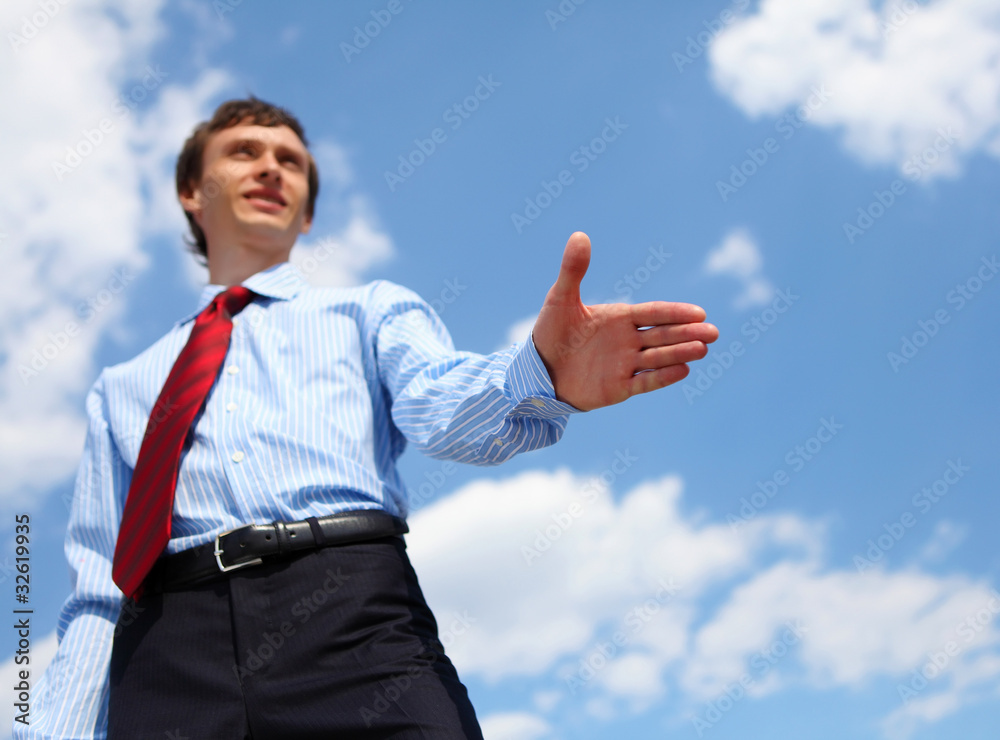 young businessman in a blue shirt and red tie young businessman in a blue shirt and red tie