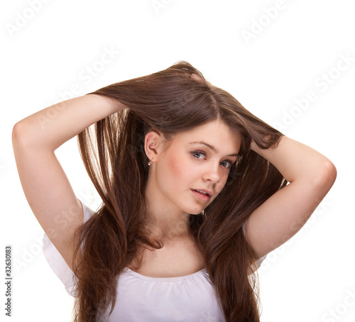 Portrait of a beautiful teen girl with long hairs and clean skin