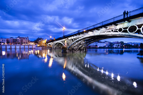 Sevillie, romantic panorama of the bridge and the riverside