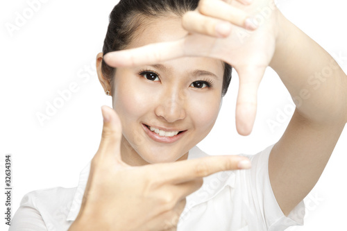 smiling young woman making a hand frame