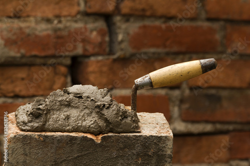 Tool   shovel   glue    cement © olegusk